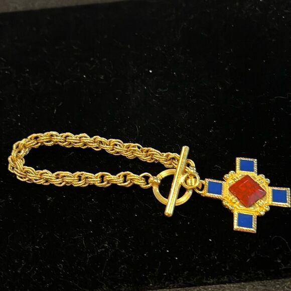 Jewelry - Gold Tone Bracelet with Toggle Closure and cross charm. WA402